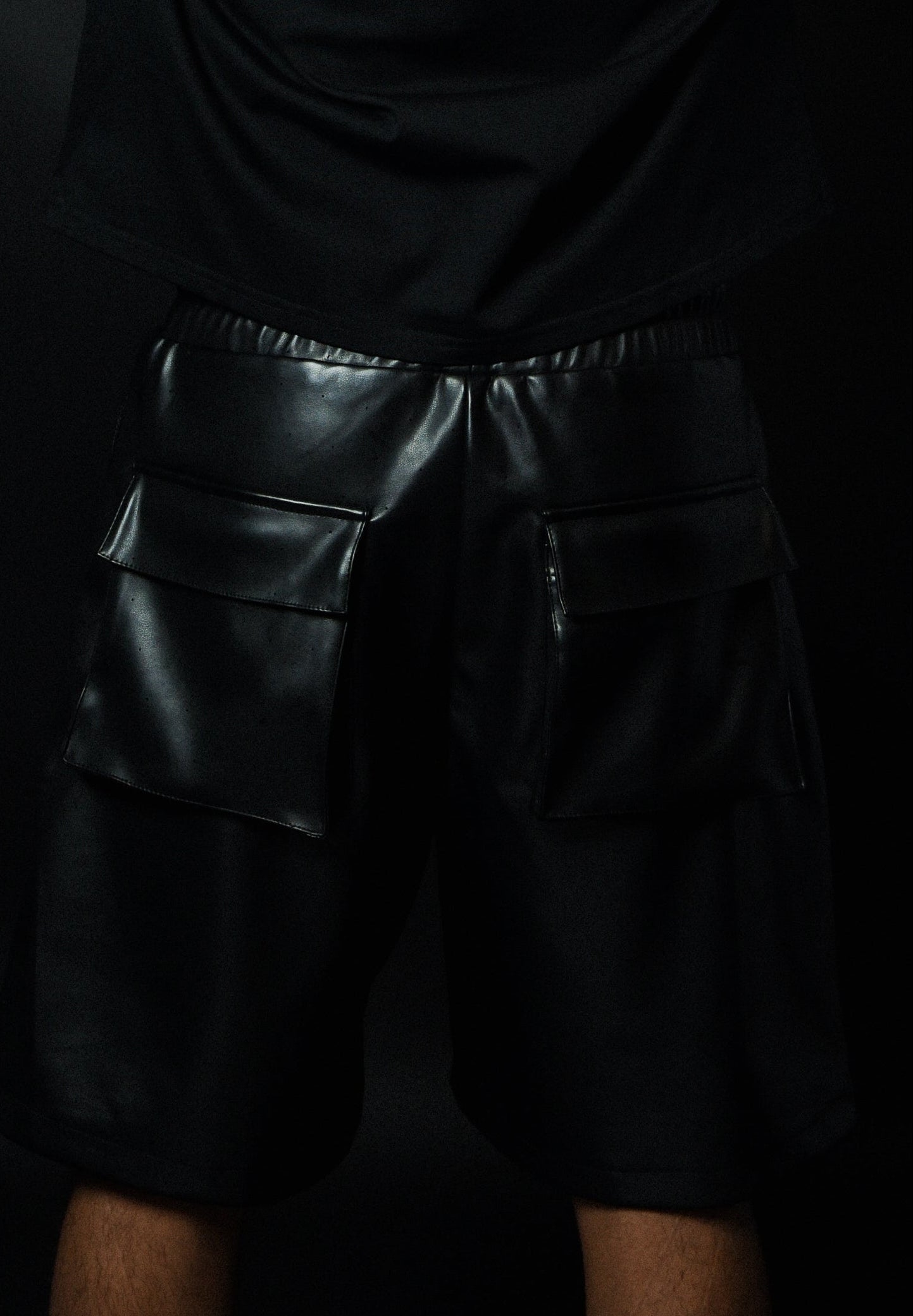 Rear view of model wearing MALDITO Restraint leather shorts
