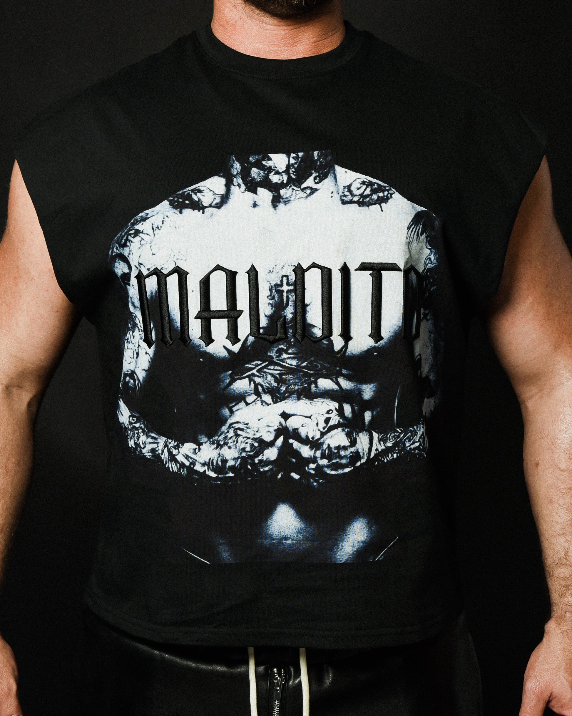 Close-up of MALDITO The Forged cut-off tee graphic and raw sleeve detailing